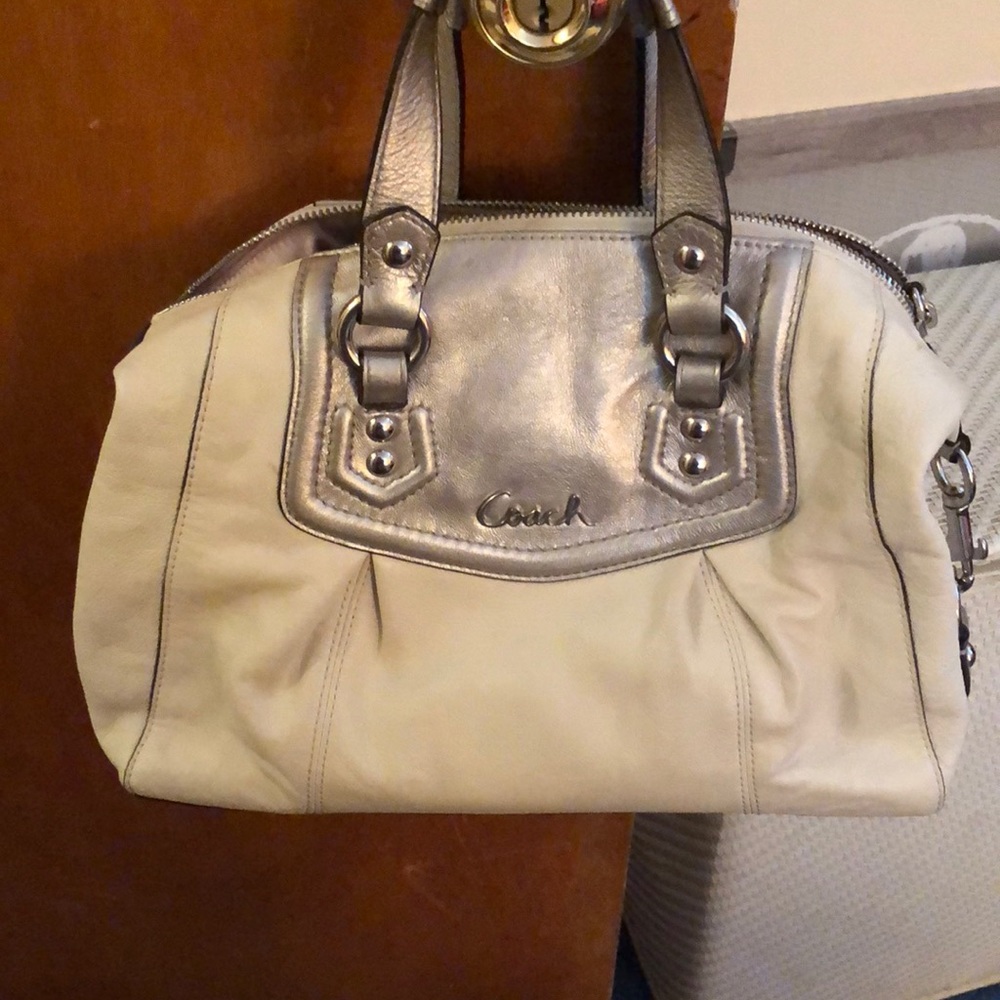 Silver and white coach purse